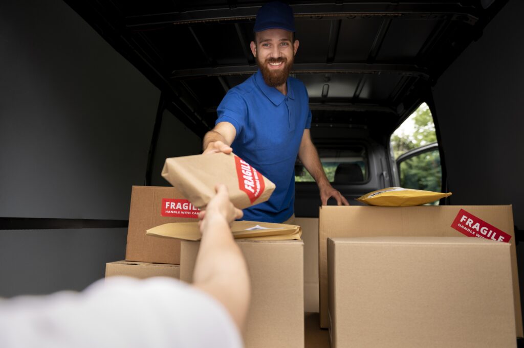 close-up-delivery-man-holding-box